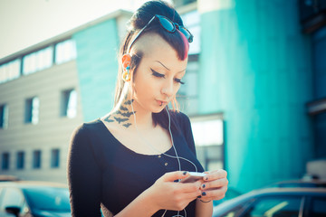 Wall Mural - young beautiful punk dark girl listening music