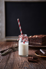 Wall Mural - Bottle of Cold Milk with Paper Straw