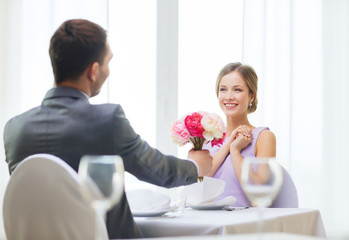 Canvas Print - smiling woman recieving bouquet of flowers