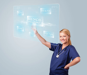 Young nurse pressing modern medical type of buttons