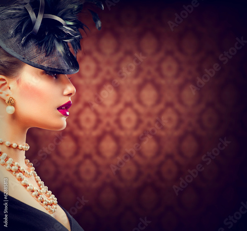 Retro Woman. Vintage Styled Girl with Retro Hairstyle and Makeup