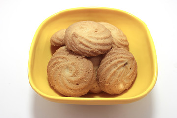 homemade pastry cookies in Melamine bowl on white back