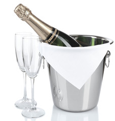 Poster - Bottle of champagne in pail and empty glasses, isolated on