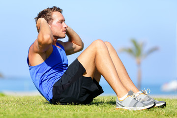 Wall Mural - Sit-ups - fitness man training sit up outside