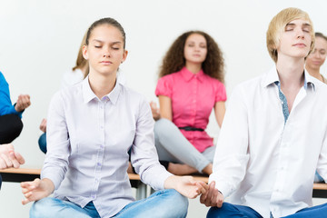 Wall Mural - group of young people meditating