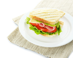 Wall Mural - Tasty sandwich with ham, isolated on white