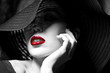 Mysterious woman in black hat. Red lips