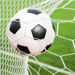 © tungphoto - soccer ball in the goal net
