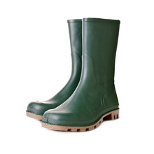 Green Rubber Boots On White Background