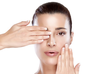 Wall Mural - beautiful spa girl with hands on her face. skincare concept