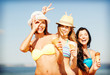 © Syda Productions - girls in bikini with ice cream on the beach