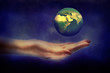 Hand holding Earth