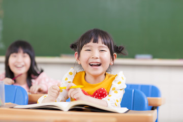 Canvas Print - happy children studying in a classroom