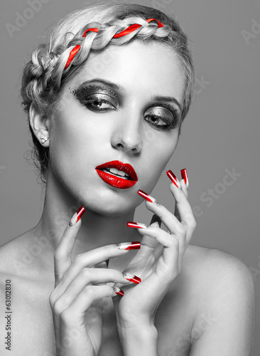 Fototapeta na wymiar Young woman with red nails