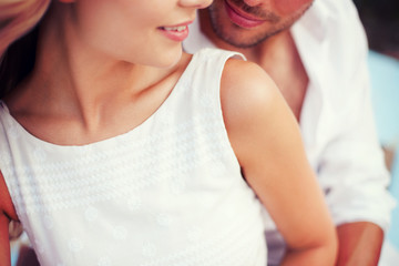 Canvas Print - couple in shades at sea side