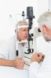 © WavebreakMediaMicro - Optometrist doing sight testing for senior patient