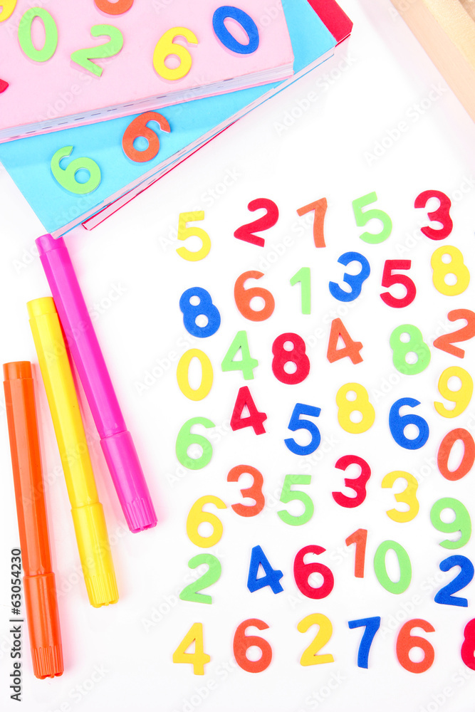 Colorful numbers, abacus, books and markers, isolated on white