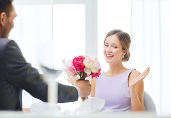 Poster - amazed woman recieving bouquet of flowers