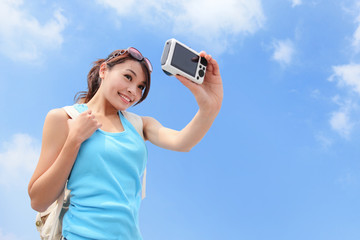 Poster - Happy woman traveler photo by camera