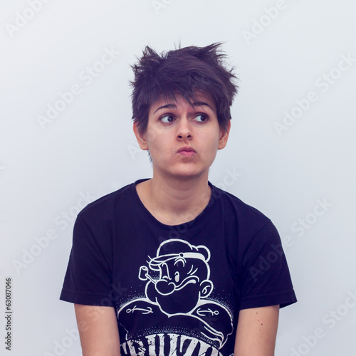 Closeup Of Cocky Short Haired Girl Looking Sideways On White Buy