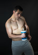© Maria Vazquez - Muscular man with dumbbells