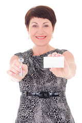 Wall Mural - middle aged female estate agent holding key and visiting card