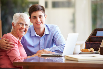 Canvas Print - Teenage Grandson Helping Grandmother With Laptop