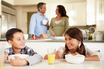 Wall Mural - Hispanic Family Eating Breakfast At Home Together