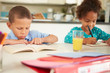© Monkey Business - Children Doing Homework Together At Table