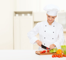 Poster - smiling female chef chopping vagetables