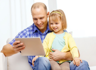 Wall Mural - happy father and daughter with tablet pc computer