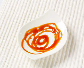 Wall Mural - Caramel drizzle sauce