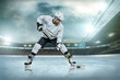 © Andrii IURLOV - Ice hockey player on the ice. Open stadium - Winter Classic game