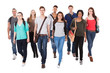 © Andrey Popov - Confident University Students Walking Over White Background