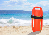 Fototapeta Uliczki - Lifeguard buoy on the beach