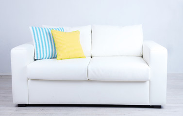 Sticker - White sofa with colorful pillows in room