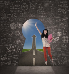 Wall Mural - Asian female student jump on success road