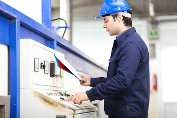 Poster - Portrait of an electrician at work