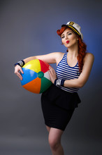 Pin Up Girl In Sailor Suit Blowing A Kiss