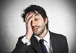 © hppd - Stressed businessman with hand on the head