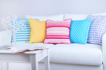 Poster - White sofa with colorful pillows in room