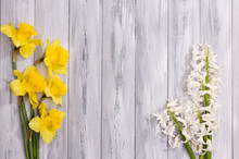 Beautiful Flowers On Color Wooden Background