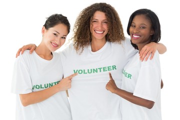 Canvas Print - Attractive team of volunteers smiling at camera