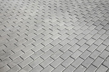 gray paving stones on the sidewalk