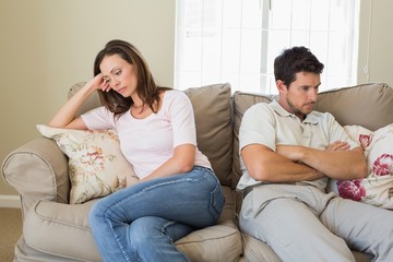 Wall Mural - Couple not talking after an argument in living room