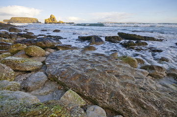 Rocks in shade on beach