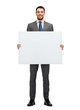 © Syda Productions - smiling businessman with white blank board