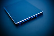 © ifeelstock - SSD disk drive in blue technological background - tilt-shift