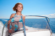 © ZoomTeam - Summer vacation - young girl driving a motor boat