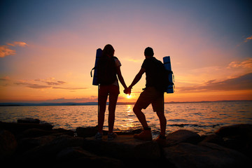 Wall Mural - Hikers at sunset